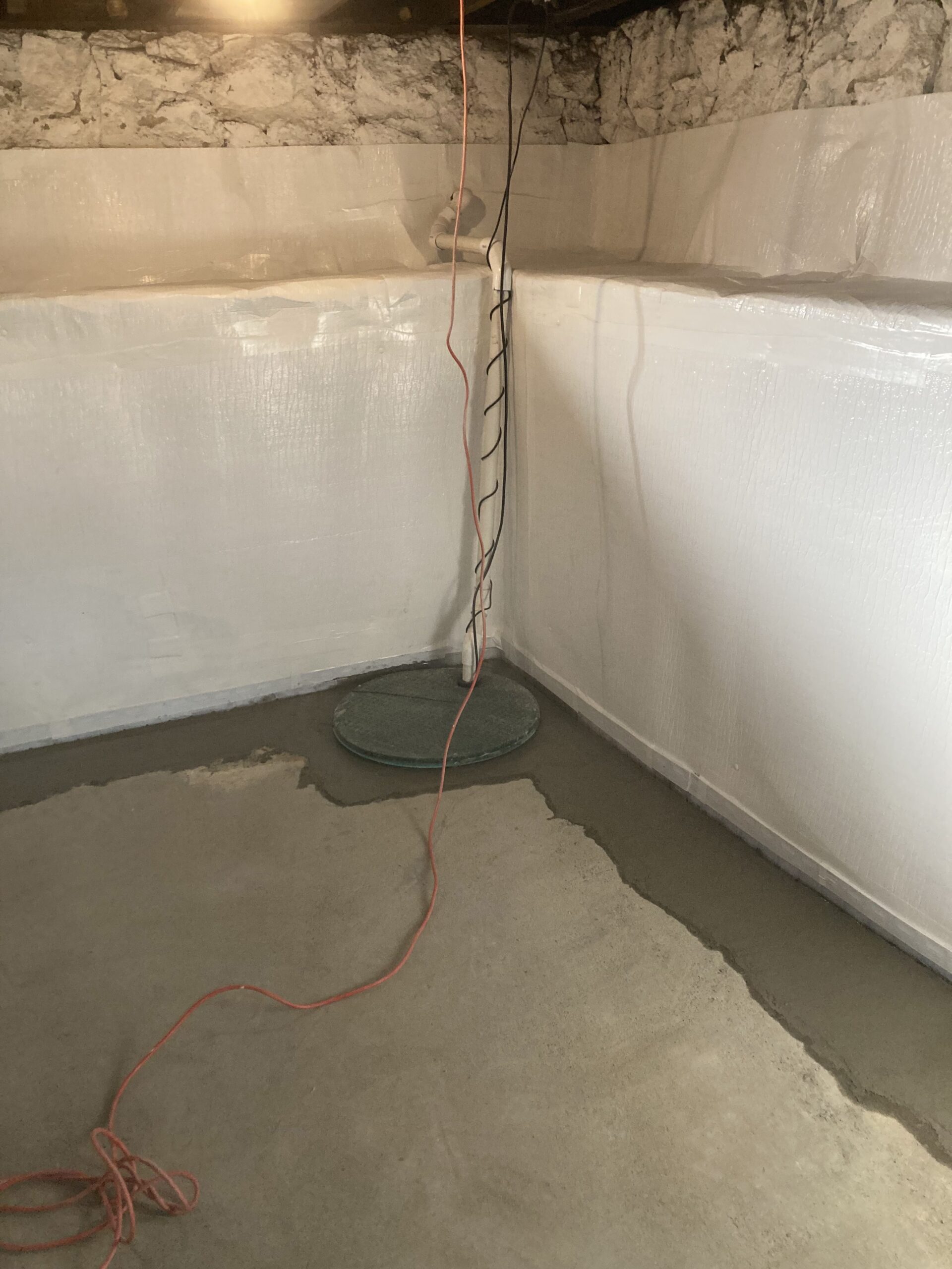 a corner of a waterproofed basement